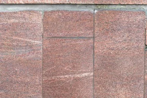 Textures of natural stone: a close view of patterned granite blocks in mute.. Stock Photos