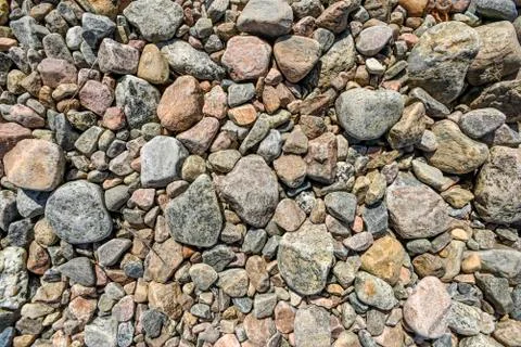 Textures of stones in different colors lying on the ground Stock Photos