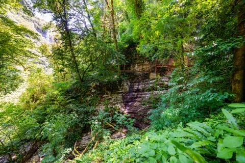 Textures of various stone layers at wall on hiking trail Stock Photos