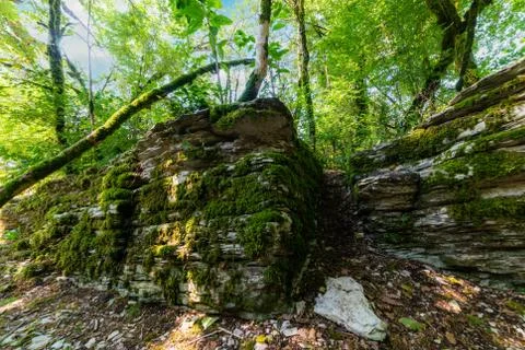 Textures of various stone layers at wall on hiking trail Stock Photos