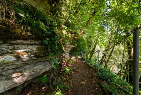 Textures of various stone layers at wall on hiking trail Stock Photos
