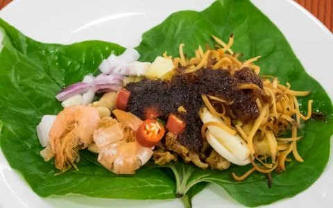 Thai appetizer leaf wrapped with herbs (Miang Kham) Stock Photos