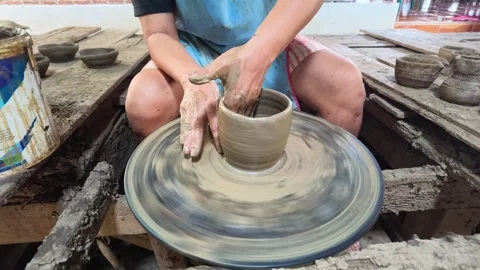 Thai Artisan Shaping Clay Pot on Spinning Pottery Wheel Stock Footage 341393428