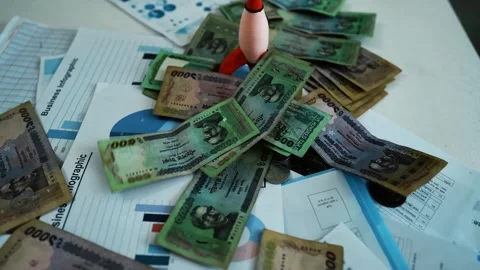 Thai Baht Banknotes on Business Charts, A pile of Thai baht banknotes scatt.. Stock Footage 304961453