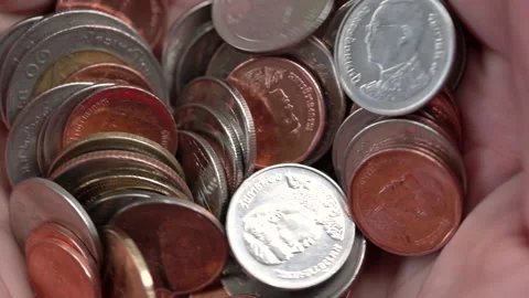 Thai baht coin money stack in hand, slow motion Stock Footage 131639737