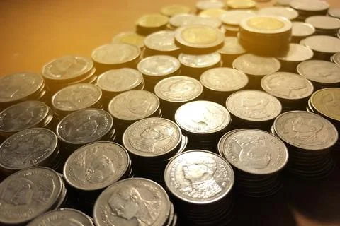 Thai Baht coins stack with soft light background. Thai coin in concept of f.. Stock Photos