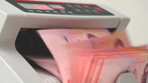 Thai Baht money counting in Machine. Paper THB Thai baht banknotes. Fast cash Stock Footage 171616552