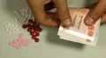 Thai Baht THB, Counting Drugs and Money, Health Care, Colorful Pills HD Footage