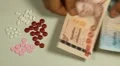 Thai Baht THB, Counting Drugs and Money, Health Care, Colorful Pills HD Footage