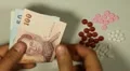 Thai Baht THB, Counting Drugs and Money, Health Care, Colorful Pills HD Footage