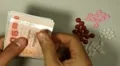 Thai Baht THB, Counting Drugs and Money, Health Care, Colorful Pills HD Footage