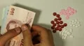 Thai Baht THB, Counting Drugs and Money, Health Care, Colorful Pills HD Footage