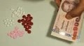 Thai Baht THB, Counting Drugs and Money, Health Care, Colorful Pills HD Footage