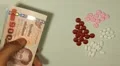 Thai Baht THB, Counting Drugs and Money, Health Care, Colorful Pills HD Footage