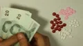 Thai Baht THB, Counting Drugs and Money, Health Care, Colorful Pills HD Footage