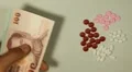 Thai Baht THB, Counting Drugs and Money, Health Care, Colorful Pills HD Footage
