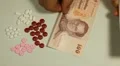 Thai Baht THB, Counting Drugs and Money, Health Care, Colorful Pills HD Footage