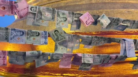 Thai banknotes attached as offerings at Golden Mount temple in Bangkok, Thailand Video stock 336564516
