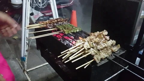 Thai barbecued or Thai style grill on a roadside of Thailand. 4k. Stock Footage 75229060