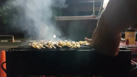 Thai barbecued or Thai style grill on a roadside of Thailand. 4k. Stock Footage 75229634