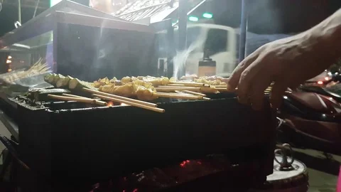 Thai barbecued or Thai style grill on a roadside of Thailand. 4k. Stock Footage 75229669