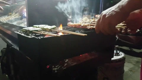 Thai barbecued or Thai style grill on a roadside of Thailand. 4k. Stock Footage 75230632
