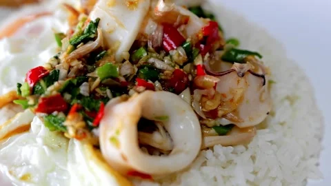 Thai Basil Squid Rice with Fried Egg Stock Footage 344400055