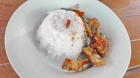 Thai Basil Stir Fried Crispy Pork Served With Steamed Rice Stock Photos