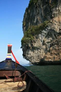 Thai boat front and cliffs Photos