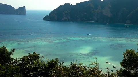 Thai boats go between the islands of Phi Phi Stock Footage 77997448