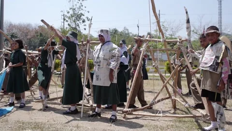 Thai Boy Scout activity joyful boys and girls teams battle play wooden catapult Stock Footage 157281958