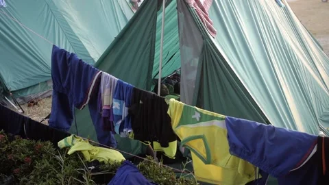 Thai Boy Scout camp tent in the morning clothes drying on the rope outside Stock Footage 157441610