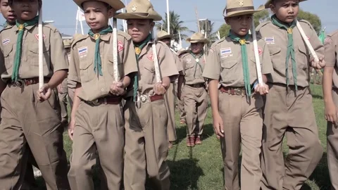 Thai Boy Scout students on parade boys in uniform walking toward camera Stock Footage 157699104