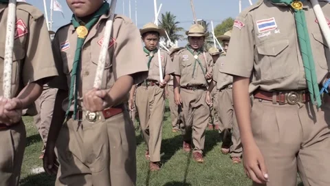Thai Boy Scout young students on parade, boys in uniform walking toward camera Stock Footage 157698869