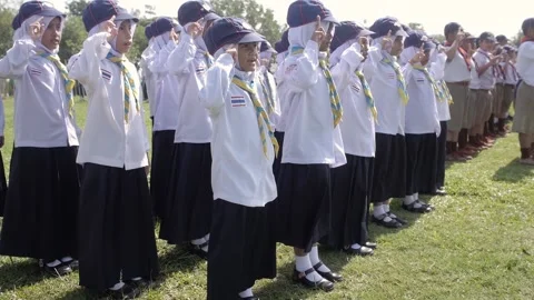 Thai Boy Scout young students on parade Muslim girls in hijab saluting Stock Footage 157699236