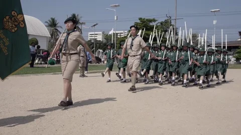 Thai Boy Scout young students on parade marching, cute little girls in uniform Stock Footage 157700306
