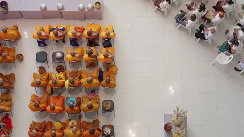 Thai Buddhist Monks &amp; Crowd Sit &amp; Pray During Indoor Visakha Bucha Day Ceremony Stock Footage 247592444