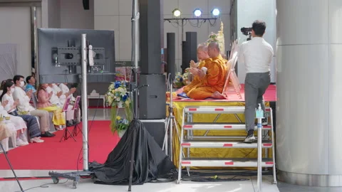 Thai Buddhist Monks Pray On Stage, Crowd Prays, Camera Man Takes Video Photo Видео 247580361