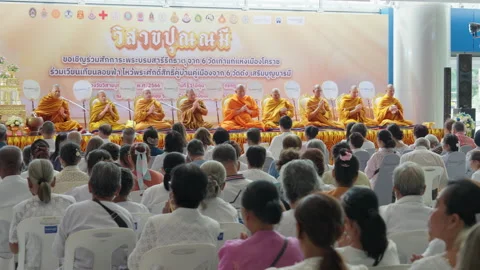 Thai Buddhist Monks Sit Chant &amp; Pray, Crowd Audience Watch Indoor Vesak Festival Stock Footage 247665552