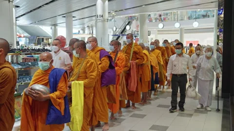 Thai Buddhist Monks Stand, Wait In Line With Alms Bowl To Collect Gift Offering Stock Footage 247617116