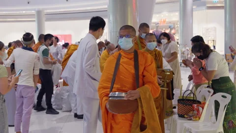 Thai Buddhist Monks Walk In Line With Alms Bowl, People Merit Food Offerings Stock Footage 247614957