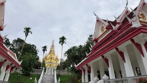 Thai Buddhist temple with ornate red white architecture Stock Footage 348802438