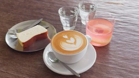 Thai Café Table with Latte Coffee Pink Drink and Cake, Overhead Shot Видео 333172689