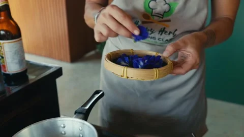 A Thai Chef Making a Thai Dessert with Thai Banana in Coconut Milk Called Vídeos de archivo 329276920