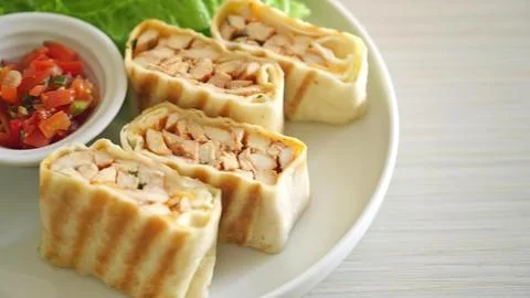 Thai chicken spring rolls with dipping sauce on white plate Stock Photos