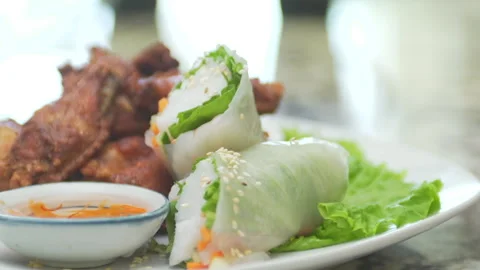 Thai Chicken Wings and Spring Rolls Stock Footage 146292203