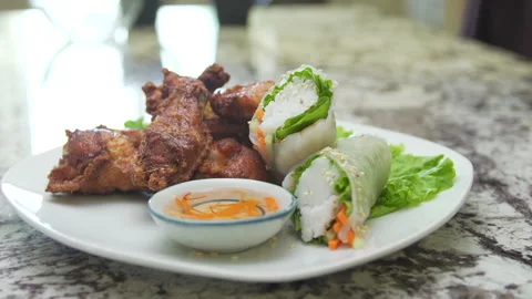 Thai Chicken Wings and Spring Rolls Stock Footage 146292524