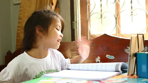 Thai child learning online by tablet ,indoor  Chiangmai  Thailand Stock Footage 130906206