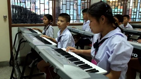 Thai Children study piano in classroom Stock Footage 46837150