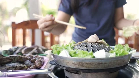 Thai common buffet, grill pork or barbecue on hot pan Video stock 133124492